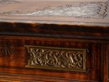 a close up of a wooden table with a clock on it