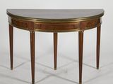 a mahogany and brass console table
