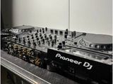two decks and a mixer on a table in a room