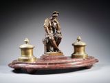 an image of a statue of a man sitting on top of a table