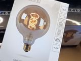 a light bulb that is sitting on top of a pile of books