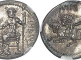 a close up of a silver coin with a man on a horse