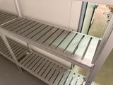 a metal shelf that has some shelves on top of it