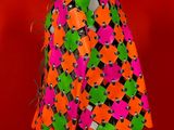 an image of a mannequin wearing a colorful jacket on a mannequin