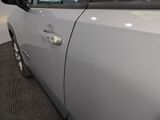 a close up of a car door handle with a sticker on it