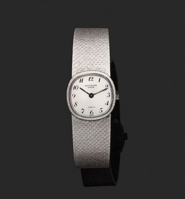 an image of a close up of a wrist watch on a black background
