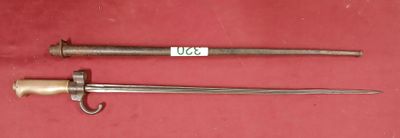 two old swords are on a red surface with a tag