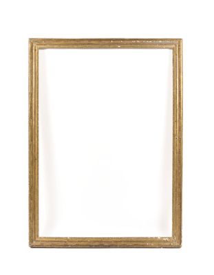 a gold picture frame on a white wall with a white background