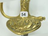 a gold colored sword with a number on it
