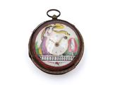 une photo d'une montre de poche sur laquelle figure l'image d'un oiseau