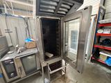 an image of a kitchen with a refrigerator and a microwave
