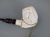 a pipe with a chain attached to it on a table
