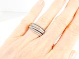 a woman ' s hand with a ring on it ' s finger