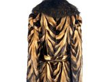 an image of a mannequin wearing a brown and black fur coat
