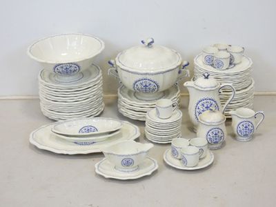a lot of dishes and cups on the table