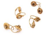 three pairs of gold - plated earrings and a pair of earrings