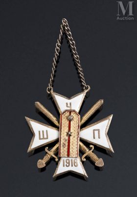 a close up of a cross on a chain on a black surface