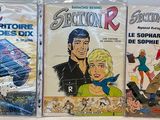 trois livres posés ensemble sur la table
