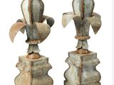 two metal vases that are sitting on top of each other