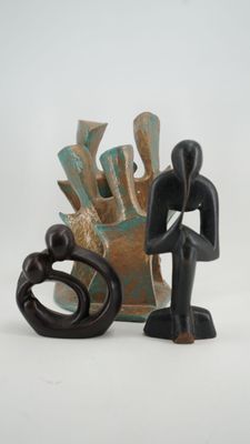 a figurine of a man and a woman standing next to each other