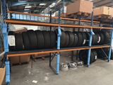 many tires stacked on the shelves in the warehouse