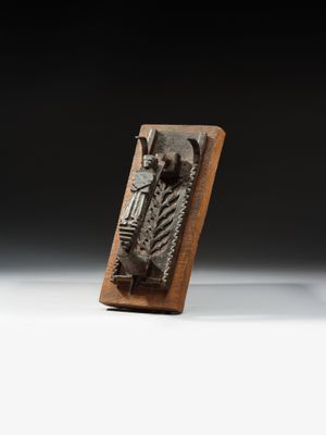 a close up of a metal object on a wooden stand