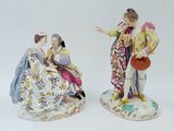 pair of porcelain figurines of a man and a woman