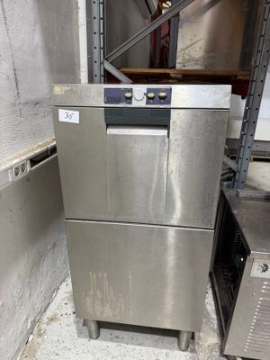 an image of a stainless steel dishwasher in a warehouse