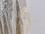 an image of a woman ' s dress made of silver foil