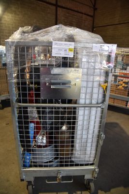 a large metal cage with a bunch of items inside of it