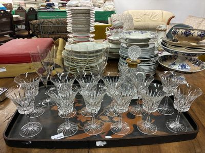 a tray with a lot of glasses and plates on it