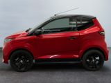 a picture of a small red car parked in a garage