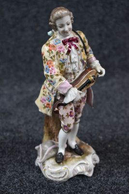 an image of a figurine of a man with a guitar