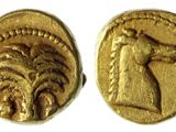 une pièce d'or sur laquelle figurent un cheval et un homme