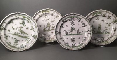six green and white plates with birds and flowers on them