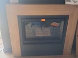 a fireplace in the corner of a room with a tv