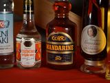 many different types of alcohol bottles on the table