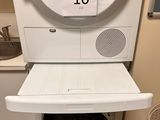 a washer and dryer in the corner of a room