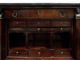 a large wooden cabinet with many drawers on it