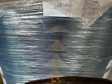 a cart full of plastic wrapped items in a warehouse