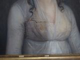 portrait of a woman in a white dress with a gold frame