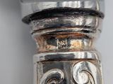 a close up of a silver object on a table