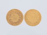 two gold coins, one of which has a crown and the other of which is a wreath