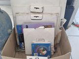 a cardboard box filled with books and other items