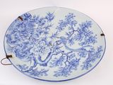 a blue and white plate with a bird on it