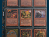 a lot of cards that are in a binder