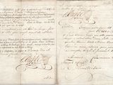 an old document with writing on it sitting on top of a table