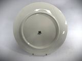 a white plate with a black design on it