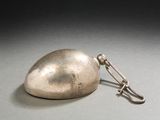 a small silver object with a metal hook on it