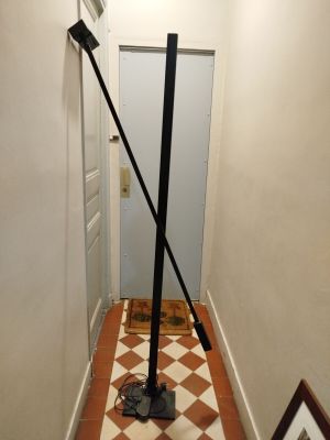 a black pole in the middle of a hallway